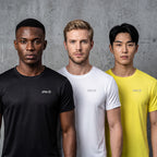 Three male models standing side by side wearing short-sleeve crew-neck t-shirts in black, white, and yellow, each with a small light gray 'playR' logo on the left chest, against a textured gray concrete wall.